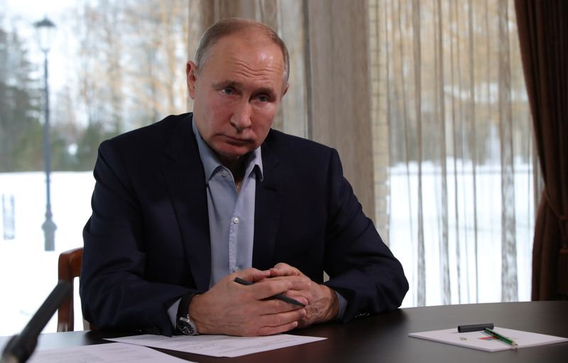 &copy; Reuters. Russian President Putin attends a meeting with university students via a video conference call in Zavidovo
