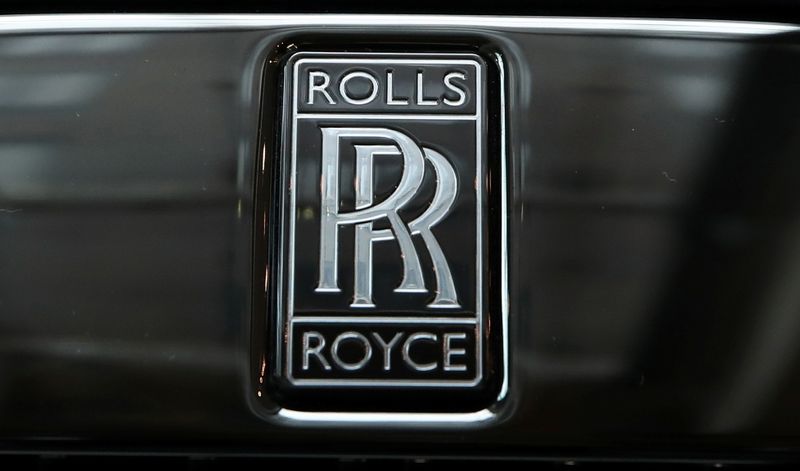&copy; Reuters. The badge of a Rolls-Royce Black Badge Dawn car is seen at a dealership in London