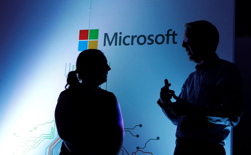 &copy; Reuters. Microsoft Corporate Vice President Michael Fortin talks to a delegate at the opening of the Microsoft Corp; Africa development centre (ADC) in Nairobi