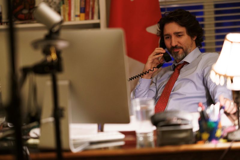 &copy; Reuters. Canada&apos;s Prime Minister Justin Trudeau speaks on the phone with U.S. President Joe Biden in Ottawa