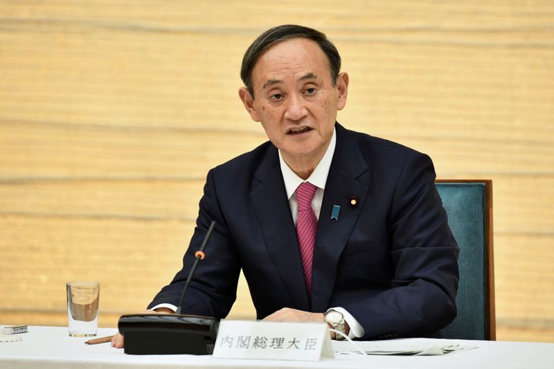 &copy; Reuters. Japanese Prime Minister Yoshihide Suga speaks during a meeting on COVID-19 in Tokyo