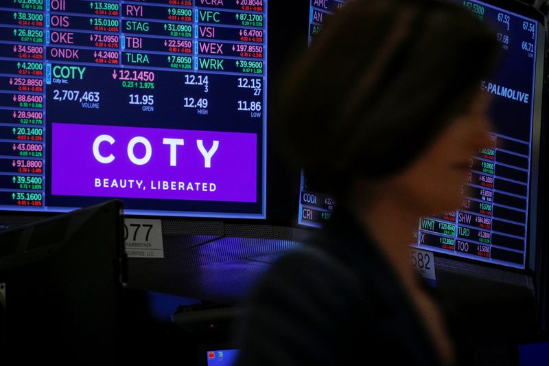 &copy; Reuters. A screen displays the logo and trading information for Coty Inc at the NYSE in New York