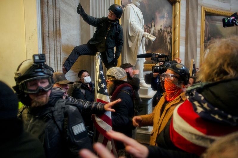 &copy; Reuters. FILE PHOTO: Trump supporters breach the U.S. Capitol