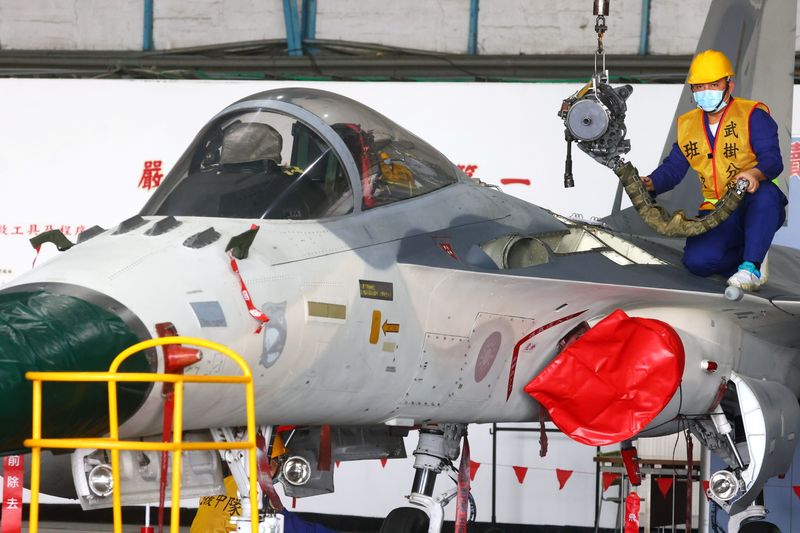 &copy; Reuters. Mechanics repair F-CK-1 Ching-kuo IDF at an Air Force base in Tainan