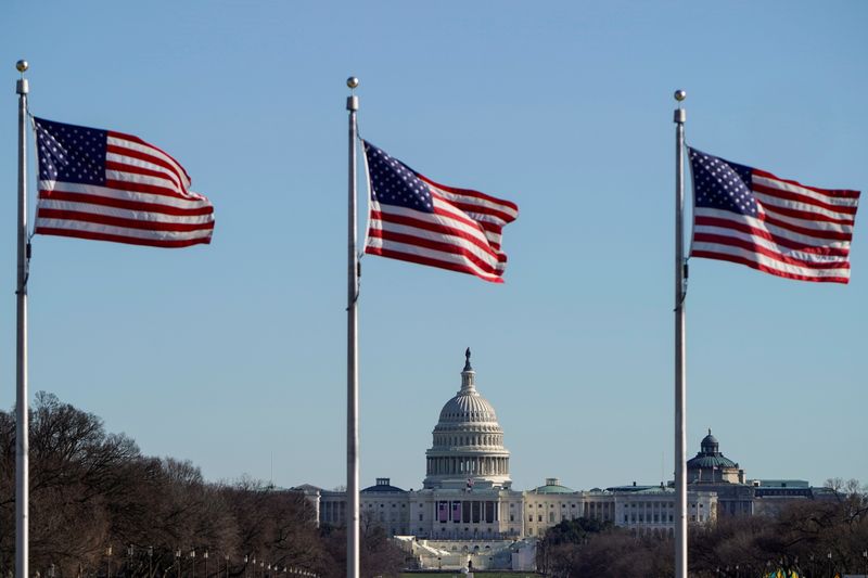 &copy; Reuters. The U.S. Capitol is seen under flags in Washington