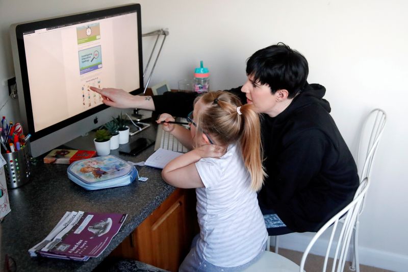 © Reuters. FILE PHOTO: Children attend school lessons at home in Milton Keynes