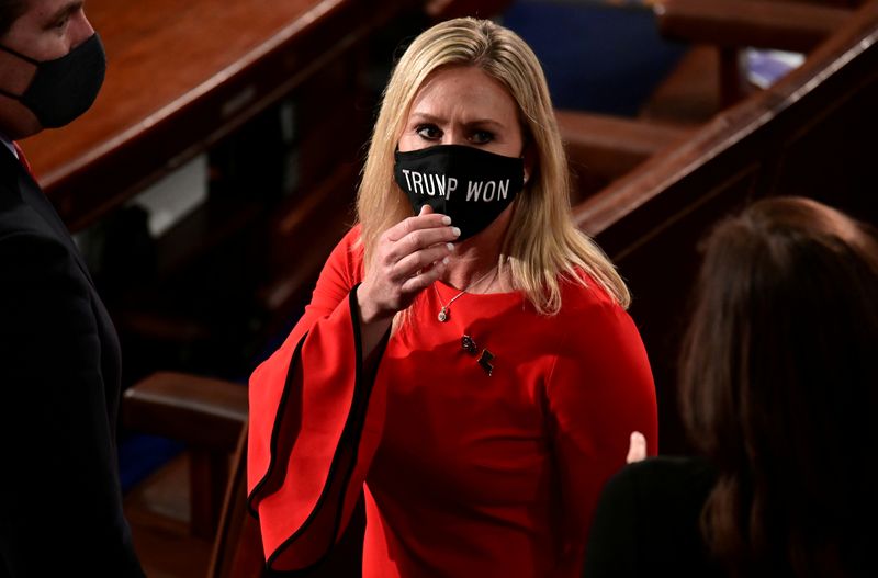 &copy; Reuters. FILE PHOTO: U.S. Rep. Marjorie Taylor Greene (R-GA) wears a &quot;Trump Won&quot; face mask as she arrives to take her oath of office as a member of the 117th Congress in Washington