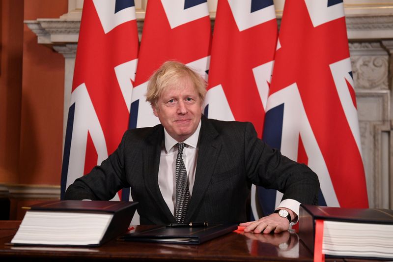 &copy; Reuters. FILE PHOTO: Britain&apos;s Prime Minister Boris Johnson signs the Brexit trade deal with EU
