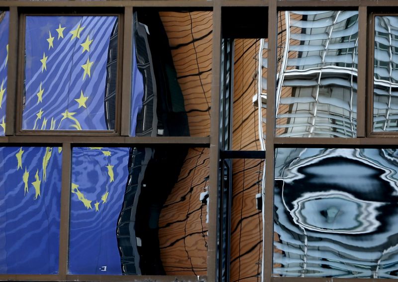 &copy; Reuters. FILE PHOTO: The facade of the EU Commission headquarters is reflected in the windows of the EU Council building in Brussels