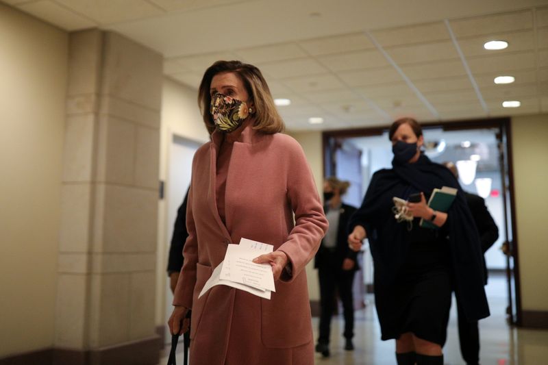 &copy; Reuters. Speaker of the House Pelosi walks to a news conference on Capitol Hill in Washington