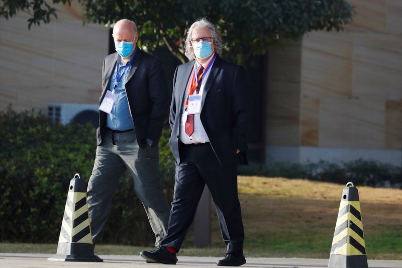 &copy; Reuters. WHO team members in Wuhan