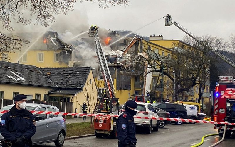 &copy; Reuters. Rescue workers are seen at the site of an explosion of a house in Langenzersdorf