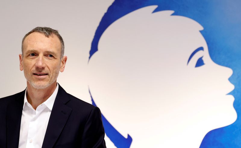 &copy; Reuters. FILE PHOTO: Emmanuel Faber, Chief Executive Officer of French food group Danone, poses before a news conference to present the company&apos;s 2019 annual results in Paris