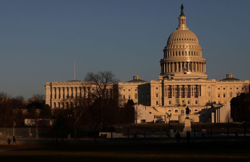 &copy; Reuters. FILE PHOTO: The U.S. Capitol Building is seen behind barbed wire fences in Washington, U.S.