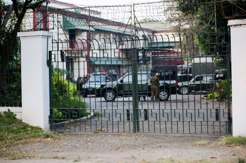 © Reuters. Myanmar military vehicles are seen inside Myanmar's national television office in Yangon