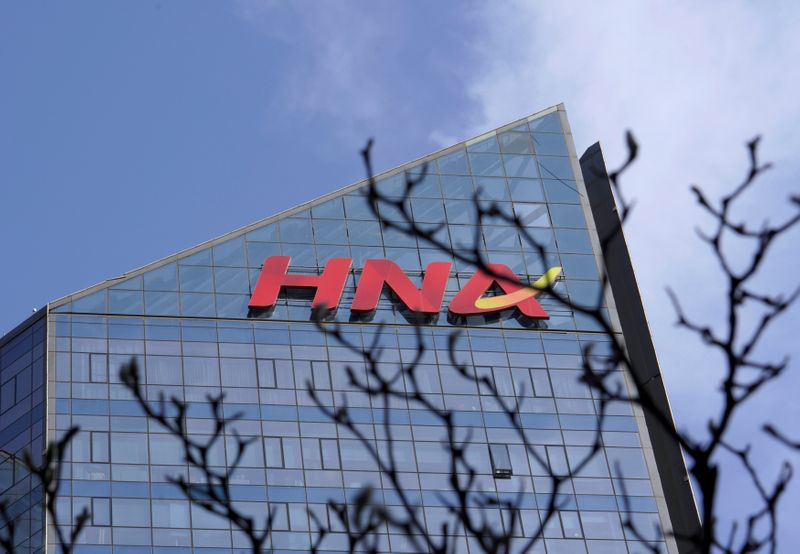 &copy; Reuters. FILE PHOTO: A HNA Group logo is seen on the building of HNA Plaza in Beijing