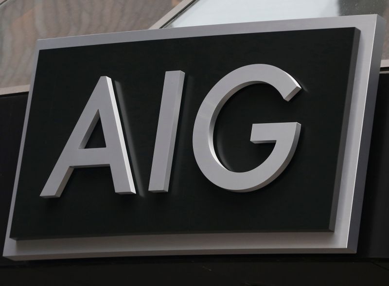 &copy; Reuters. FILE PHOTO: A sign is displayed over the entrance to the AIG headquarters offices in New York&apos;s financial district