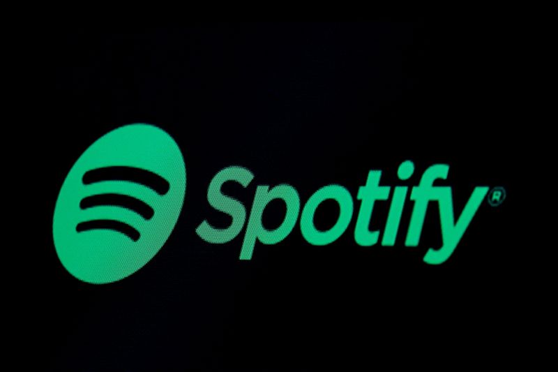 © Reuters. FILE PHOTO: The Spotify logo is displayed on a screen on the floor of the NYSE in New York