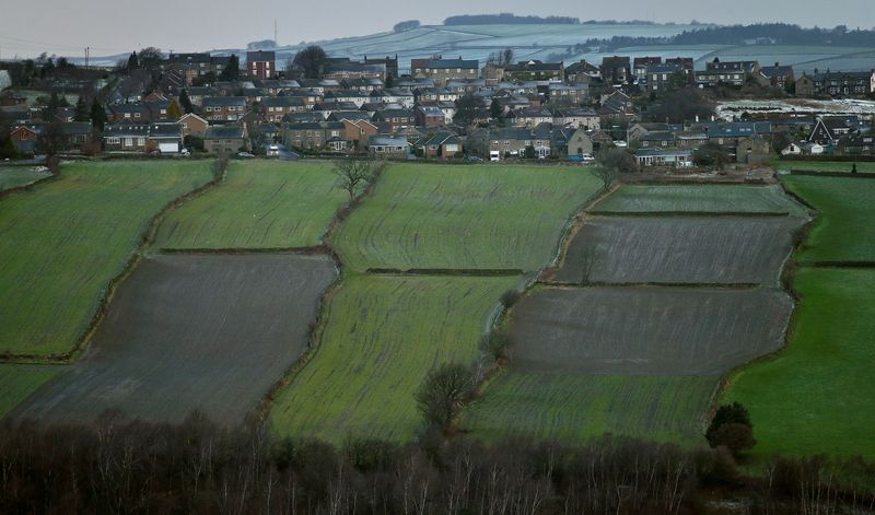 &copy; Reuters. FILE PHOTO: A housing estate is seen next to farmers&apos; fields in the Hallam constituency of Britain&apos;s Deputy PM Clegg in Sheffield