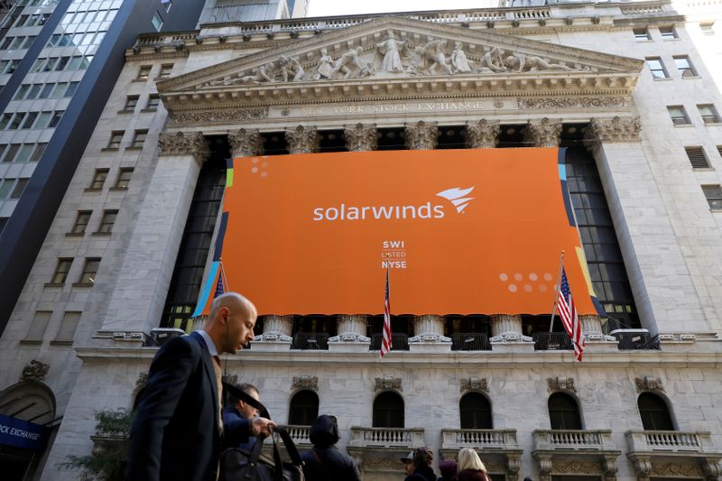 © Reuters. FILE PHOTO: SolarWinds Corp. banner hangs on the company's IPO at the NYSE in New York