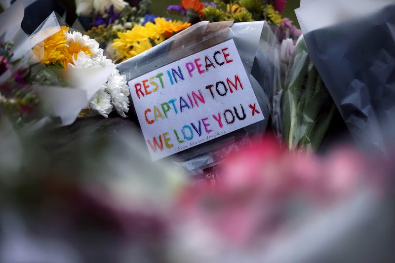 &copy; Reuters. Flowers are seen near the residence of Captain Sir Tom Moore, after his family announced that the centenarian fundraiser died, in Marston Moretaine near Milton Keynes