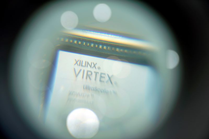 &copy; Reuters. FILE PHOTO: A chip of Xilinx is displayed through a magnifying glass during the China International Import Expo (CIIE), at the National Exhibition and Convention Center in Shanghai