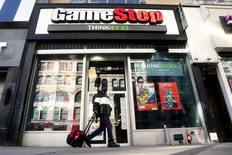 &copy; Reuters. FILE PHOTO: A person walks past a GameStop in New York