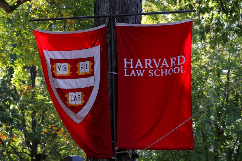 &copy; Reuters. FILE PHOTO: Banners for Harvard Law School fly during the inauguration of Lawrence Bacow as the 29th President of Harvard University in Cambridge