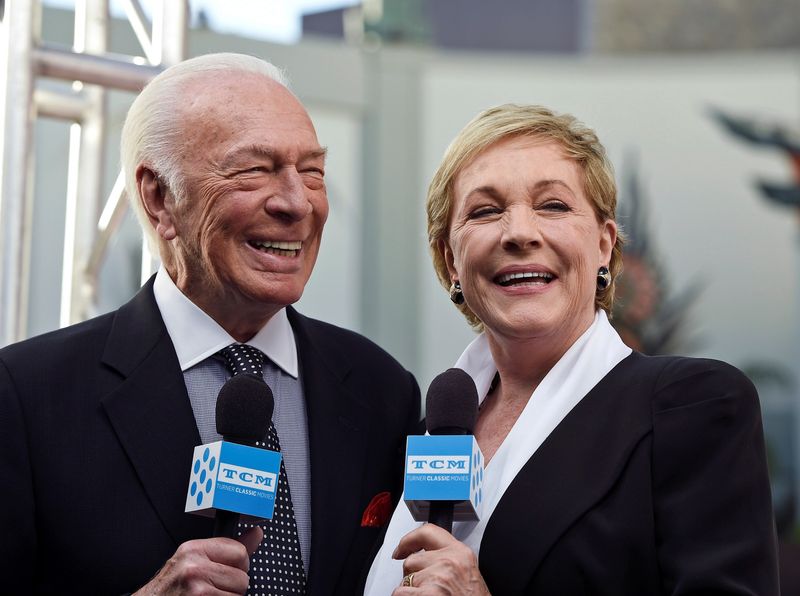© Reuters. FILE PHOTO: Cast members Plummer and Andrews are interviewed during the 50th anniversary screening of musical drama film 