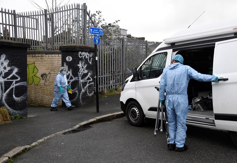 © Reuters. Police and forensics officers investigate a scene of fatal stabbing, Croydon, London