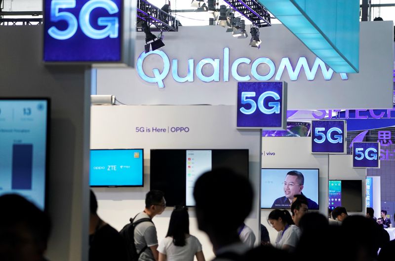 &copy; Reuters. Signs of Qualcomm and 5G are pictured at Mobile World Congress (MWC) in Shanghai