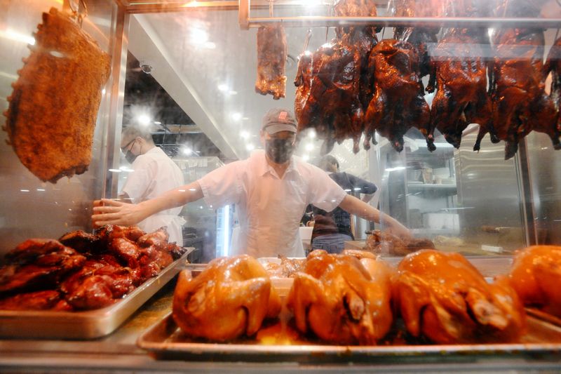 © Reuters. Barbecued meats hang in the display window at HK BBQ Master in Richmondu000d
