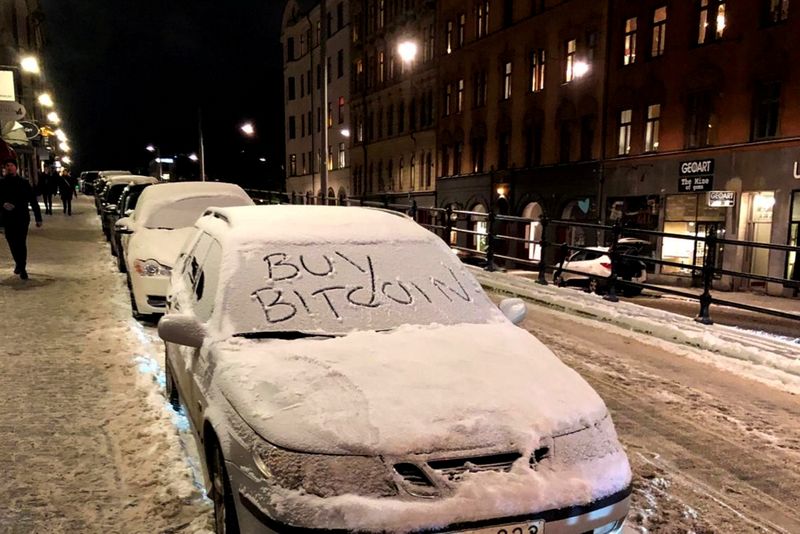 &copy; Reuters. FILE PHOTO: A car with a sign &quot;Buy Bitcoin&quot; written in snow is pictured in Stockholm