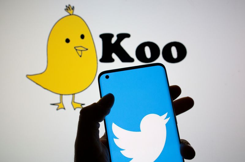 &copy; Reuters. FILE PHOTO: Twitter logo is seen on smartphone in front of displayed Koo app logo in this illustration taken,