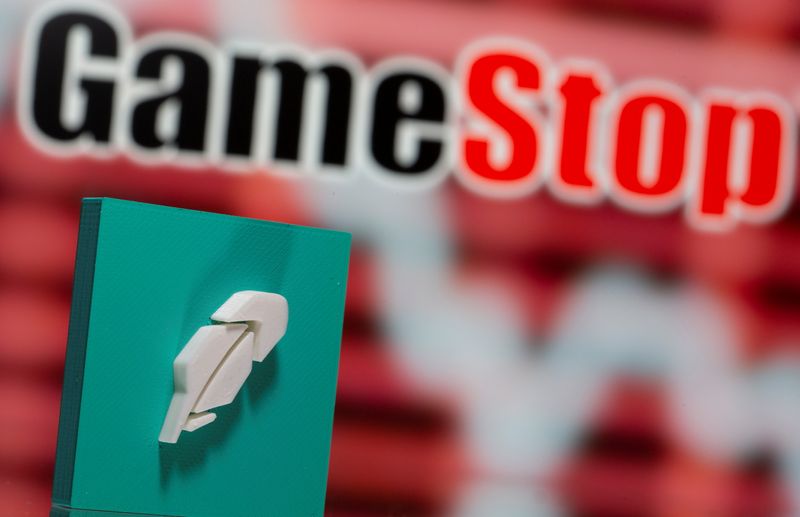 &copy; Reuters. A 3d printed Robinhood logo is seen in front of displayed GameStop logo in this illustration