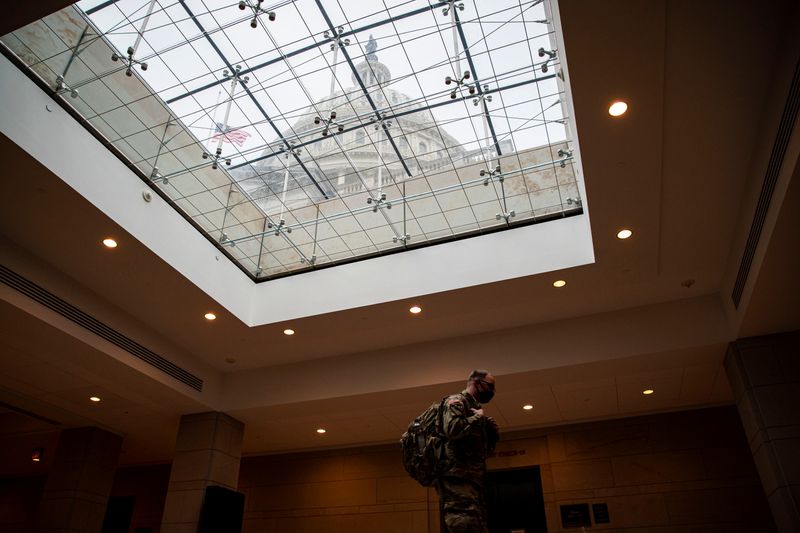 &copy; Reuters. A member of the U.S. National Guard walks though the U.S. Capitol, in Washington