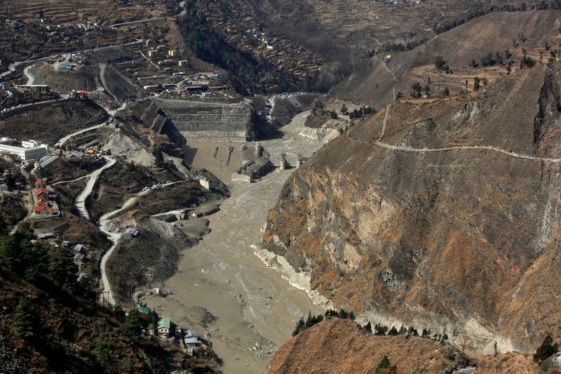 © Reuters. An aerial view shows a damaged barrage after a flash flood swept a mountain valley destroying dams and bridges, in Tapovan