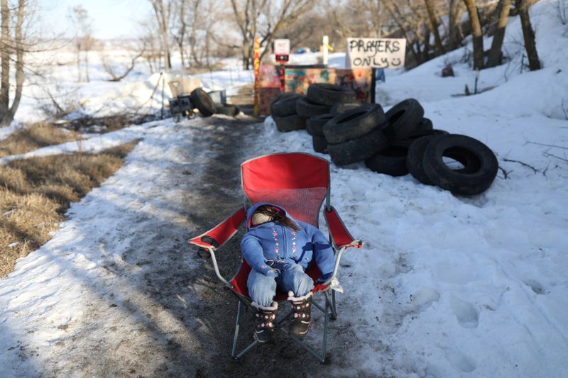 &copy; Reuters. FILE PHOTO: A makeshift doll is seen at the gate separating Rosebud camp and Sacred Stone, one of the few remaining camps protesting the Dakota Access Pipeline in Cannon Ball, North Dakota, U.S.