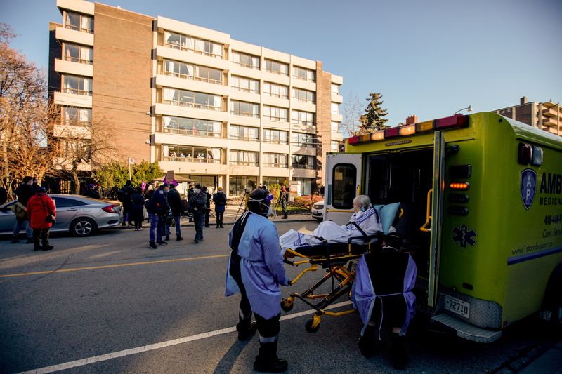 &copy; Reuters. FILE PHOTO: A woman is placed in an ambulance outside the Sienna St. George long term care home in Toronto