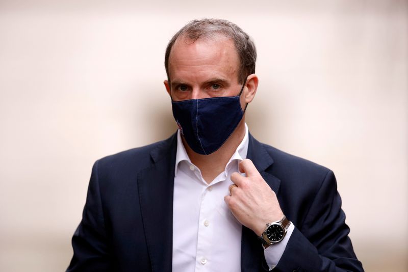 © Reuters. FILE PHOTO: Britain's Foreign Affairs Secretary Dominic Raab walks outside Downing Street in London