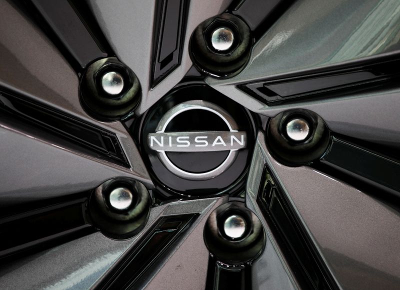 © Reuters. The brand logo of Nissan Motor Corp. is seen on a tyre wheel of the company's car at their showroom in Tokyo