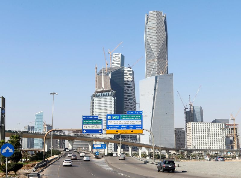 &copy; Reuters. FILE PHOTO: Cars drive past the King Abdullah Financial District in Riyadh