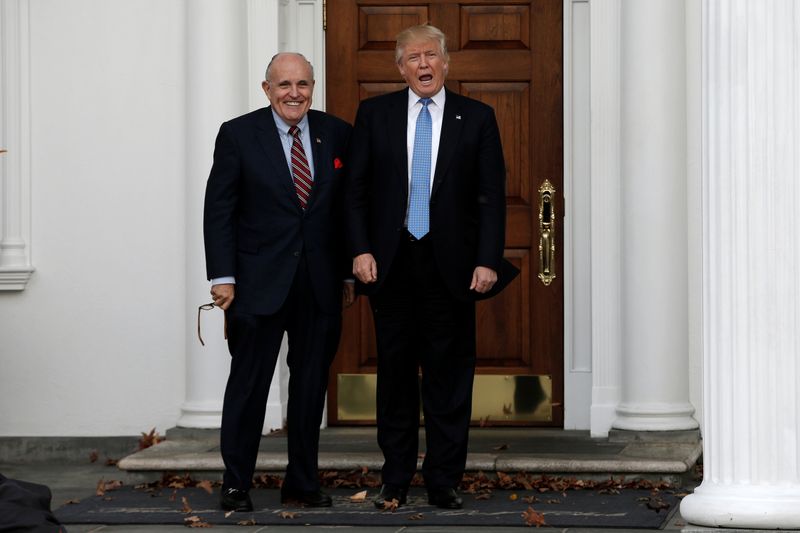 &copy; Reuters. U.S. President-elect Donald Trump stands with former New York City Mayor Rudolph Giuliani before their meeting at Trump National Golf Club in Bedminster