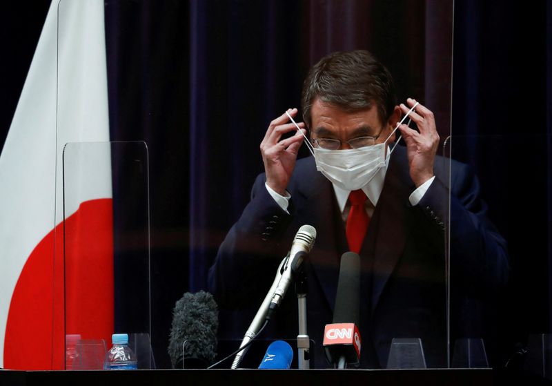 © Reuters. FILE PHOTO: Japanese minister in charge of vaccine roll-out holds news conference on preparations, in Tokyo
