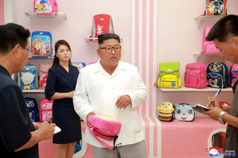 &copy; Reuters. North Korean leader Kim Jong Un and his wife Ri Sol Ju inspect the Wonsan Disabled Soldiers&apos; Bag Factory