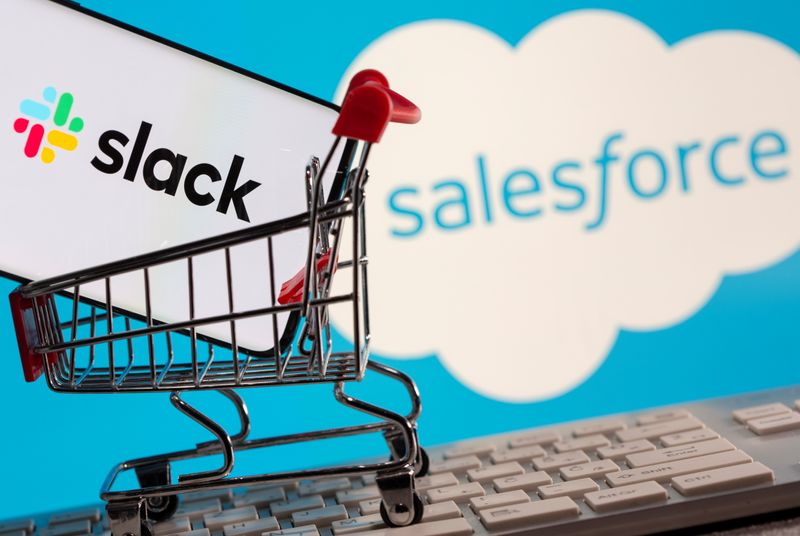 &copy; Reuters. Smartphone with Slack logo stands in a shopping cart on a keyboard in front of displayed Salesforce logo in this picture illustration
