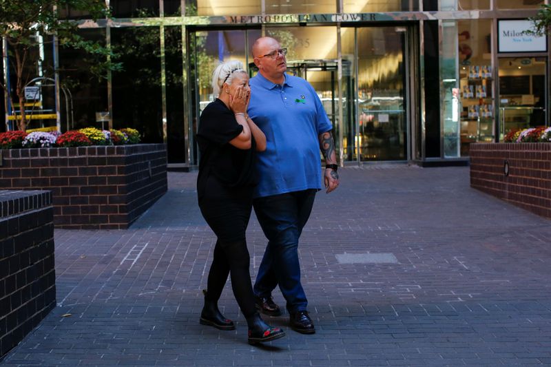 © Reuters. FILE PHOTO: Charlotte Charles and Tim Dunn, parents of British teen Harry Dunn who was killed in a car crash on his motorcycle, allegedly by the wife of an American diplomat, walk out after an interview in the Manhattan borough of New York