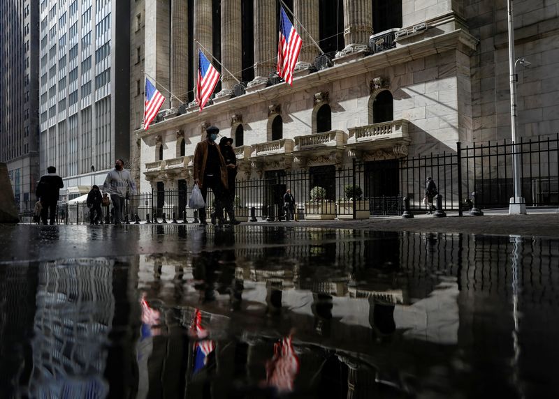 &copy; Reuters. U.S. flags fly out in front of the NYSE is seen in New York