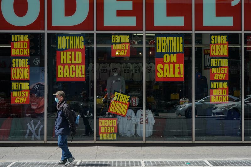 &copy; Reuters. A man stands in front of a Modell&apos;s store that is closed, as retail sales suffer record drop during the outbreak of the coronavirus disease (COVID19) in New York