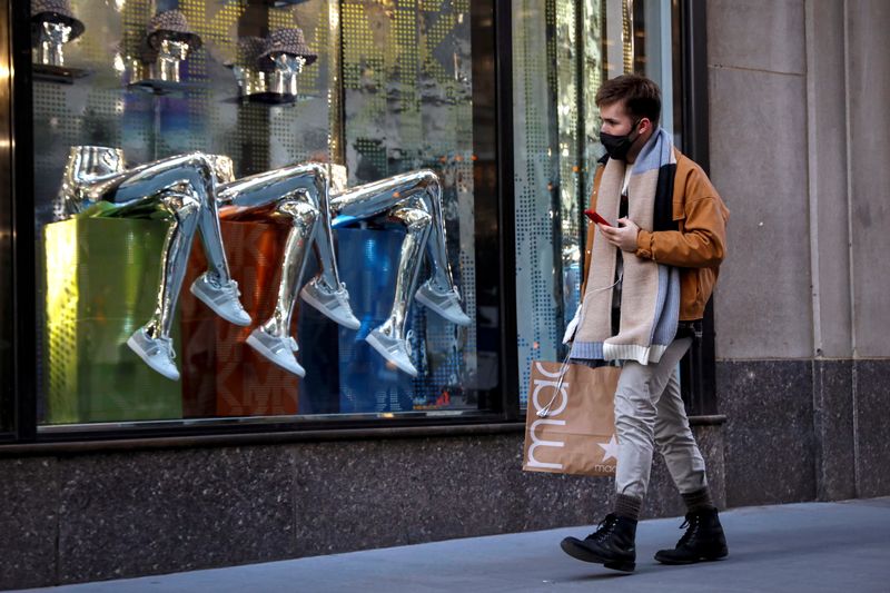 © Reuters. A man shops on 5th Avenue in New York